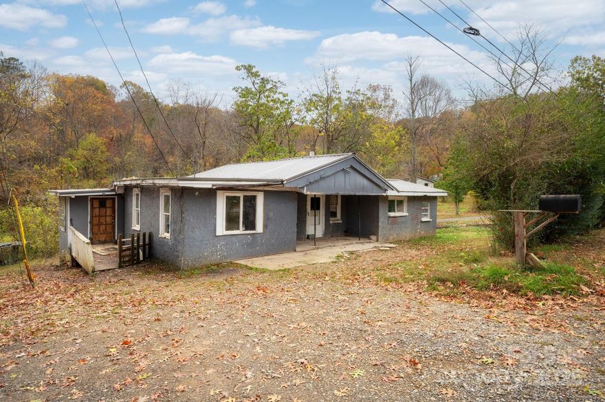 Great opportunity for investors and builders to bring their imagination and their tools! This .42 acre lot is located a short walk to Lake Tomahawk and the tennis courts and less than a mile from downtown Black Mountain. Keep as one lot or subdivide. Black Mountain zoning has confirmed possibility of three lots with UR8 zoning. Lots would require a shared driveway if you do three lots. House needs complete renovation or it could remove from the property and start fresh. The original home is block construction could keep it and build up. Sewer line has a pump system installed by town of Black Mountain. Utilities are connected. The Square footage is approximate. No survey on file. Sold As is -no repairs.