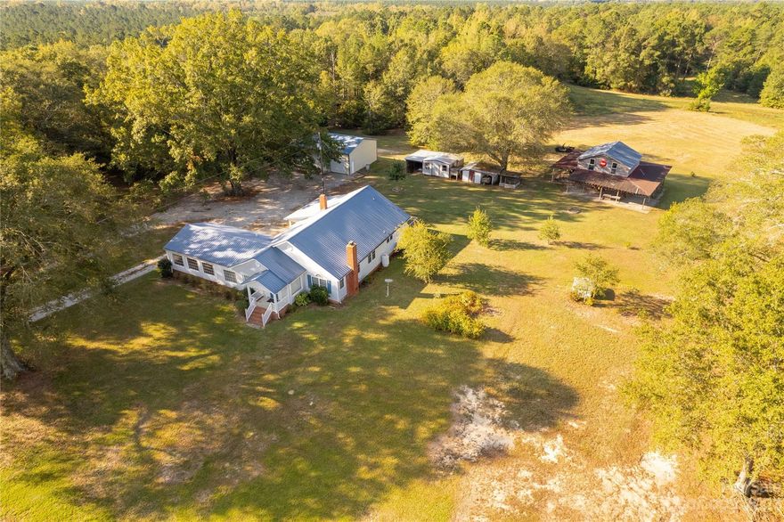 Discover country living at its finest on this 12 acre property featuring a charming home, a generous 30x40 workshop and a large barn that just needs a bathroom to make it a 2nd living quarter. Enjoy the tranquility of fishing in your own pond or 4 wheeling on the property.  30x40 workshop has a car lift that will stay. Don't miss out, call today!