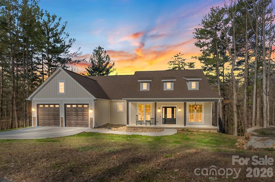 Built in 2023, this gorgeous, modern 3BR/2BA home features an incredible open floorplan, a spacious basement ready for customization and high end details! The rocking chair front porch opens into the bright and inviting living room that features 9ft ceilings. The kitchen features an expansive island with bar seating, quartz countertops, shaker style cabinets, stainless steel appliances, tile backsplash and a large eat-in area, highlighted with a board and batten accent wall. Butler's pantry off the kitchen offers additional appliance storage and could be customized for the perfect office or storage room. Primary bedroom is incredibly spacious with beautiful large windows and the walk-in primary closet features custom built-in drawers and shelving. The primary bathroom boasts a freestanding tub, two large vanities and walk-in tiled shower. Two more bedrooms on the main level, both with large closets. Beautifully finished second full bath on the main level, along with a dedicated laundry room with storage and folding counter. Full basement has been rough plumbed and framed and offers the opportunity to nearly double the square footage of your home! Basement is large enough for an additional full bathroom and multiple rooms! Back deck overlooks mature trees and a creek. In the basement, walk out onto the large covered patio and firepit area for even more space to relax outdoors. Located in desirable Deer Creek, this home is less than 20 minutes to Hickory and only around 35 minutes to Boone and the High Country!