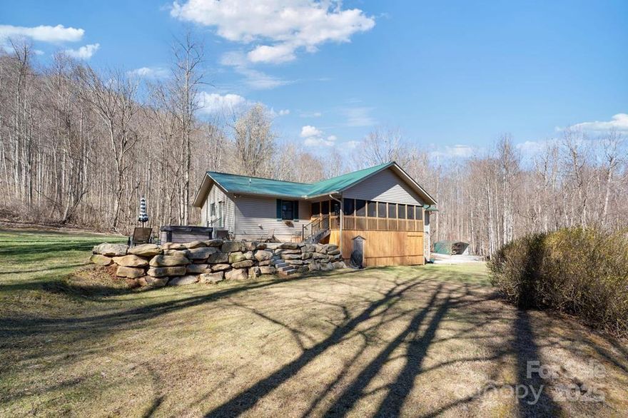 8.26 acres of pristine land with breathtaking mountain views, 3BR, 3.5BA home features T&G vaulted ceilings, hardwood floors, a spacious living area centered around a stone gas log fireplace. The kitchen, updated two years ago, with hickory cabinets, quartz countertops, a smart refrigerator, and double oven gas range. The primary en-suite with large walk-in closets. The partially finished basement features a full kitchen, bathroom, perfect as a guest suite, home office, or additional living. A 2-car basement garage plus 2 detached 2-car garages, provides space for vehicles and equipment. Outside, a private paradise with a large screened porch, a rock patio featuring a hot tub, and a beautiful yard bordering a gentle stream. A pasture area ready for animals, gardening or mini-farm. Feeling worlds away from everyday hustle yet just minutes from shopping, dining, and medical facilities. This exceptional mountain retreat delivers peace and privacy with modern amenities and room to grow.