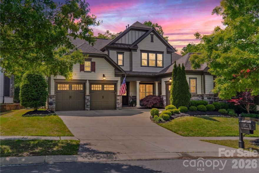 Stunning 5-bedroom, 4 full bath, 2 half bath home in the coveted Springfield community of Fort Mill, ideally positioned on the 13th green of the Springfield Golf Course. Thoughtfully designed for both everyday living and elevated entertaining, this home showcases an open-concept layout filled with natural light and refined architectural details throughout. A dramatic two-story foyer sets the tone, opening to an inviting floor plan anchored by a spacious family room with cathedral ceilings, a stacked stone fireplace, and a wall of windows framing picturesque backyard and golf course views. The chef’s kitchen serves as the heart of the home, featuring a large island with farmhouse sink, gas cooktop, split cooking design with double ovens, a walk-in pantry with custom built-ins, and new GE Café refrigerator and dishwasher. The adjacent dining area with built-in bar and beverage refrigerator, along with a light-filled sunroom with travertine flooring and sliding doors, enhances the home’s effortless flow for entertaining. The main level offers a luxurious primary suite with vaulted ceilings, a spa-inspired bath complete with garden tub, tiled shower, dual vanities, and a custom closet system. A private guest suite with en-suite bath, dedicated office with French doors and designer finishes, powder bath, and a well-appointed laundry room with custom cabinetry complete the main level. Upstairs, exceptional flexibility continues with three additional bedrooms, including a well-appointed secondary suite with a private sitting area, spa-inspired bath with heated floors, and a wall of windows overlooking the backyard. Another secondary bedroom features a spacious custom closet with a built-in washer and dryer, while the third offers its own en-suite bath. A versatile loft with convenient access to a powder bath along with walk-in attic storage offering excellent functionality and abundant storage options. Outdoor living is equally impressive, with a covered porch featuring a tongue-and-groove ceiling and travertine flooring, complemented by a deck designed for low maintenance, perfect for relaxing or entertaining while enjoying the serene backyard views. Additional highlights include hardwood flooring, custom designer lighting, a whole-house water filtration system, and a spacious 3-car garage with split configuration. A golf cart is included, enhancing the ease of enjoying the community’s amenities and golf lifestyle. Springfield offers a premier lifestyle with resort-style amenities including championship golf, clubhouse, pool, fitness center, tennis, pickleball, playgrounds, walking trails, and direct access with included membership to the Anne Springs Close Greenway. Conveniently located near I-77, Charlotte, and the airport, and zoned for top-rated Fort Mill schools.