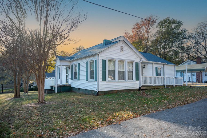 Charming three-bedroom, one-bath home in Kannapolis with great potential. Perfect for those ready to roll up their sleeves and add a personal touch. Large dining area and living room. Original hardwood floors in some of the rooms. Situated on a corner lot, this property features a storage building and a fully fenced backyard for added privacy. There is also a handicapped ramp that is easily accessible from the two-car detached carport. This home offers both space and character. Home was rewired approx 6-7 years ago, some new plumbing, roof is only 5 years old and new A/C was installed in 2013.  Conveniently located near resturants, medical facilities, shopping and more.