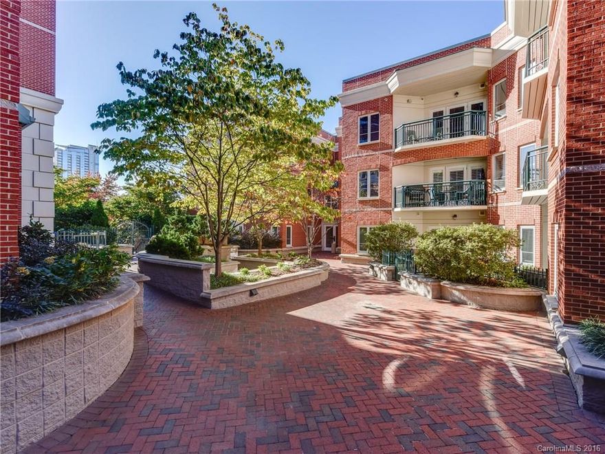 A unique condo in Jefferson Square ~ 2 Units combined into one w/ over 2400 sq ft, incl. 3 Bdrm w/ Dual Mstr, 2.5 Baths, Chefs Kitchen w/double ovens, gas cooktop & Convection Micro. Separate Dining Rm. Living Rm w/ Gas FP. Office w/ French doors. 2 Balconies overlook the Courtyard & include a Gas Line for a Grill.  Unit includes 2 secure Parking Spaces and Storage Unit! Building Amenities include:Courtyard, Gym, Dog Walk. Walkability to BofA Stadium, TimeWarner Cable Arena, Shopping & Dining.