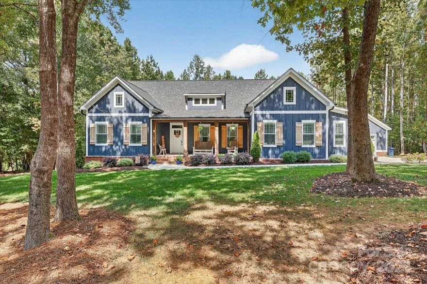 Discover refined living in this stunning 2-year-old custom-built home nestled in the sought-after Catawba Shores Estates community! Set on a level, wooded 1.61-acre lot along the tranquil Catawba River, this beautifully designed home offers 2,971 sq ft of thoughtfully crafted indoor and outdoor living space.

Featuring 4 spacious bedrooms (including a luxurious main-floor primary suite), 3 full baths PLUS an oversized bonus room, this home boasts soaring 9-foot ceilings, abundant natural light, plantation shutters, and upgraded lighting throughout. An open concept great room features a vaulted ceiling & blends beautifully into the gourmet kitchen, perfectly situated for entertaining. The kitchen is a chef’s dream - complete with two-toned cabinets, an oversized island, quartz countertops, stainless steel appliances, a farmhouse-inspired hood, subway tile backsplash, under-cabinet lighting, and a walk-in pantry with custom built-ins.

The main-floor primary suite showcases a coffered ceiling, a spa-like ensuite with dual vanities, a frameless glass shower, soaking tub, and a walk-in closet with an upgraded system. Upstairs, you'll find an additional bedroom, a full bath, and an oversized bonus room that can be utilized as an office, playroom, add'l bedroom, or a casual space for the entire family to relax & enjoy.

Enjoy outdoor living at its finest with a charming rocking chair front porch, a screened-in rear porch, and a custom paver patio w/ walkway lighting overlooking the private, wooded backyard. For car enthusiasts or hobbyists, the property offers both an attached 2-car garage and a detached 2-car garage/workshop (734 sqft) with full power, overhead storage racks, epoxy-coated floors, and multi-use locker storage.

Additional highlights include a generator hook-up, an irrigation system (front & back) and a fully encapsulated crawl space for added comfort and peace of mind. Conveniently located near shopping, dining, and recreation, this exceptional home is move-in ready and designed for both everyday living and entertaining.
