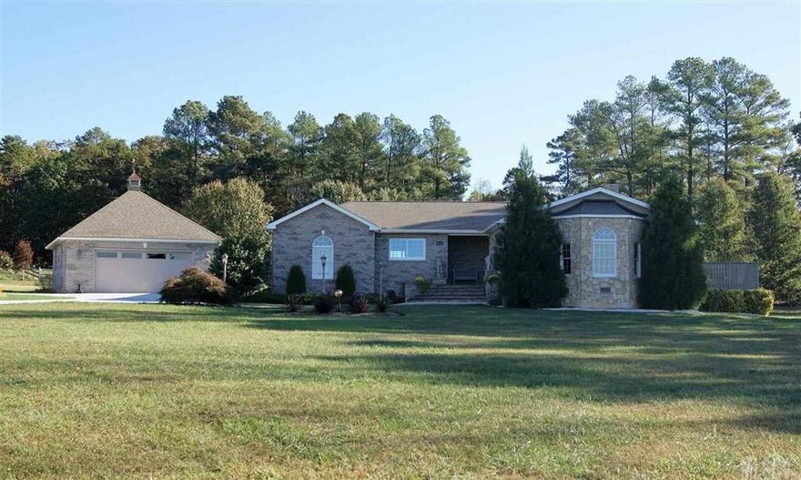 This impeccable 4 bedroom home is ready for you to move into and put your personal stamp on.  The home has many custom details throughout.  The large kitchen boasts an equally well appointed pantry, 2 sink prep areas and a built in desk. Two master bedrooms provide space for guests and one has a jetted garden tub.  One level living with centrally located laundry.  Outdoor entertainment space abounds with a deck, patio and beautiful custom built gazebo. Enjoy a large level lot perfect for enjoying gardening or play.  Detached double garage offers a workshop paradise and the utility building provides ample storage of outdoor equipment. Location of home gives parents ability to turn into local schools away from traffic.