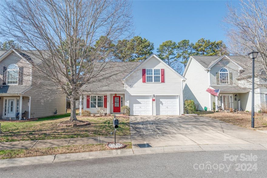 Welcome to 537 Dayton Road in Rock Hill, South Carolina! This spacious home boasts cathedral ceilings in the open living room, creating an inviting atmosphere. The main level features a primary suite and an additional bedroom with a half bathroom. Upstairs, three more large bedrooms with cathedral ceilings await, along with another full bathroom and ample storage space. The fenced backyard is perfect for entertaining, with a covered patio, while the front porch offers a peaceful spot for enjoying your morning coffee. Conveniently located near Rock Hill's private airport, shopping, and restaurants, and just a short drive from exit 82 on I-77. Cosmetic updates are needed and the home is priced accordingly with built-in equity. Don't miss out on this opportunity for comfortable living in a desirable community! This home qualifies for down payment and closing costs grants.