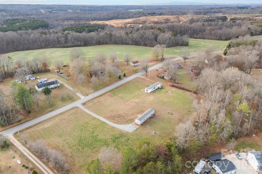 Discover country living with room to grow! This like-new 2022 manufactured home sits on a brick foundation and offers comfortable living on approximately one and a half acres, PLUS an additional adjoining parcel of roughly 1 acre included in the sale. The 3-bed, 2-bath layout features an open concept design, fresh finishes, and a spacious yard complete with a storage building.

Currently tenant-occupied until March 2026, this property is an excellent investment opportunity—keep it as a rental, build your dream home or garage on the extra parcel, or create a perfect multi-generational setup with room for a mother-in-law home.

Whether you’re seeking an income-producing asset or planning to enjoy a serene country setting yourself this spring, this versatile property in Course, NC offers exceptional possibilities and space to make your vision a reality.