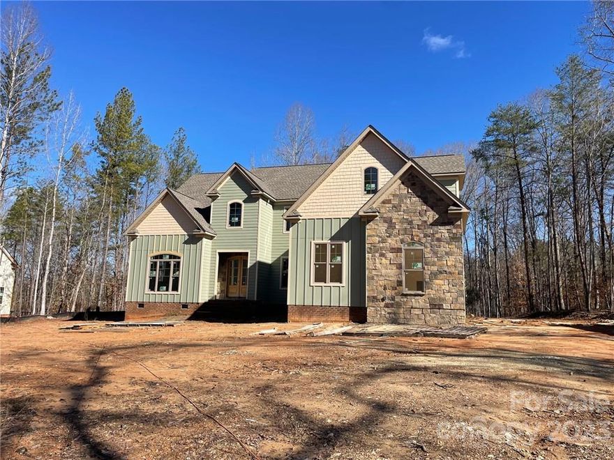 Gorgeous custom home built with Clover schools. This house has all kinds of luxurious upgrades. Huge kitchen with tons of cabinets including glass front uppers, gas range, double islands one large enough for lots of seating. Spacious laundry room with sink and cabinets and built in doggie bedroom or storage area! Shiplap in 2 story great room. Office with French doors. Master on main with oversized shower, custom closet and walkout to screen porch. Upstairs 3 additional large bedrooms and oversized bonus room. HUGE closets!! Tons of storage in this house. 3 car garage. Private lot with lots of trees around it. Plenty of room in the back for buyers to add a pool. Home should be complete within about 90 days of listing.