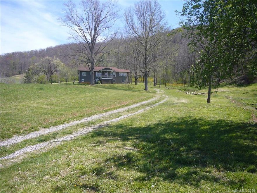 MOUNTAIN VIEWS, PASTURE, CREEK, SPRING, BARN AND 3/1 MOVE IN READY HOUSE. 23.6 ACRES READY FOR YOUR PETS, GARDENS, AND MAYBE ANOTHER HOME OR TWO. ONE BEDROOM HAS NO CLOSET, WOULD MAKE GREAT OFFICE WITH LOTS OF NATURAL LIGHT. ABOVE GROUND BASEMENT WOULD MAKE GREAT SHOP PRIVATE SETTING WITH FRUIT TREES JUST 5 MINUTES TO SHOPPING, 15 MINUTES TO DOWNTOWN ASHEVILLE.