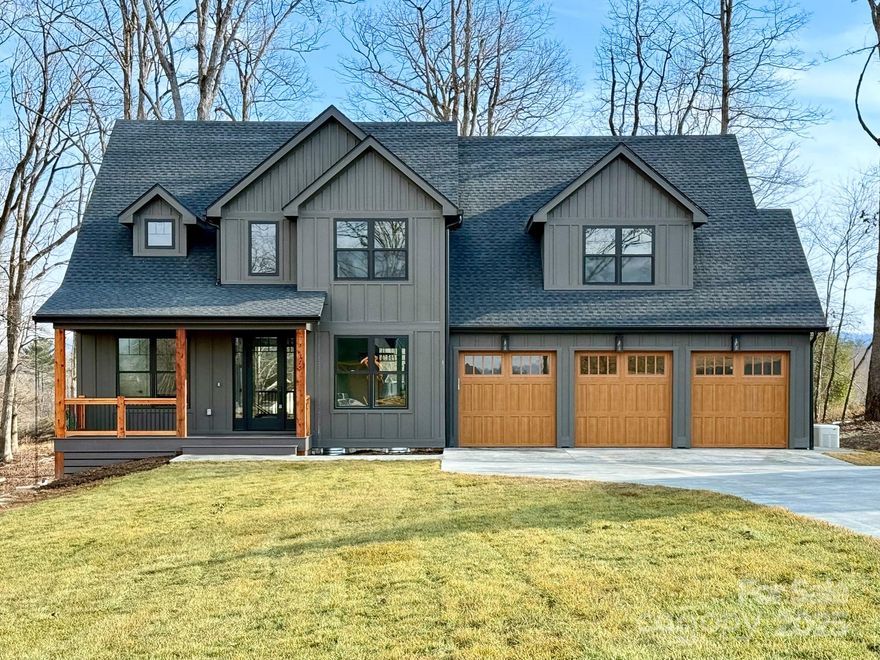 The Reserves at Roper Farm is a gated community that offers unrivaled Mills River views, luxury finishes, large lots, community pavilion, dog park, & walking trails. This completed home boasts rich wood flooring, 10' ceilings & 8’ solid doors throughout the main floor, gourmet kitchens w/ beautiful countertops, ZLine appliances, 48” gas range, pot filler, beverage fridge, & 42” cabinets. The open concept draws you to the living room w/ stone gas fireplace & leading to the you to enjoy peaceful WNC outdoors on the screened composite deck w/ stone fireplace. The primary suite offers an en suite bathroom, spa-like tile shower, & walk-in closet w/ wood shelving system. Featuring a whole home generator, Anderson windows, tankless recirculating water heater, spray foam insulation, which are a small part of high quality construction & finishes raising the bar for this magnificent home.