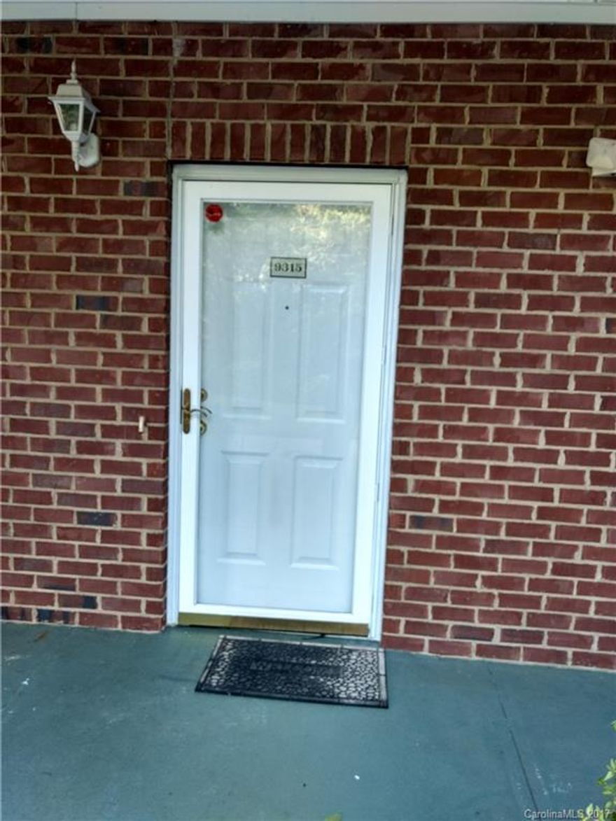 Vacant and move-in ready open floor plan with 2 bedroom, 2 bath condominium near UNC-Charlotte.  Immaculate condition, refrigerator and washer dryer stays.  Ceramic tile in kitchen, foyer and both bathrooms. White cabinets in kitchen and both bathrooms. Kitchen window has 1/2 window shutters.   Screened door.  New water heater and A/C replaced in July 2015.