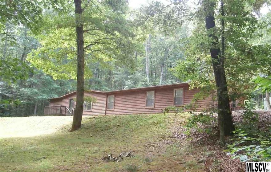 Unique and private, this manufactured home sits on almost 9 acres with woods, pasture area and small stream. This home has cedar siding with rock underpinning, four bedrooms (septic permit is for 3 bedrooms) and 3 baths, a laundry/mud room, open den and kitchen area, with a living and dining room with cathedral ceilings. This home features a split bedroom plan, Jack-n-Jill bath for two of the bedrooms and a large master suite with jetted tub, separate shower, and walk in closet. Enjoy the wildlife, serenity, peace and quiet of country living!