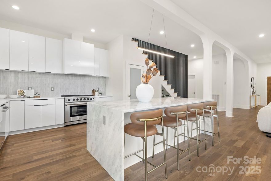 Discover luxury city living in the heart of Elizabeth—one of Charlotte’s most walkable, historic, and highly sought-after neighborhoods with great schools! Recently appraised at $1,789,000, this new construction home offers rare instant equity at closing! Known for its tree-lined streets, charming character homes, and unbeatable proximity to Uptown Charlotte. Elizabeth places you just moments from the city’s best dining, shopping, parks, and entertainment. 

Refined craftsmanship and elevated finishes define the home’s interior. 10’ ceilings, 5” White Oak hardwood flooring, designer lighting, and custom cabinetry set a warm and sophisticated tone. Natural light fills the main living spaces through thoughtfully placed Pella windows, emphasizing clean lines and timeless style.

At the center of the home, the chef’s kitchen features premium appliances, a wine cooler, and an oversized island that seamlessly connects the dining and living areas, perfect for gatherings or everyday living. From here, enjoy easy indoor-outdoor flow to the covered Trex deck and fully fenced backyard, creating an inviting extension of your entertaining space.

The main level also includes a private guest suite and a dedicated office, offering flexibility for hosting, working from home, or multigenerational living.

Upstairs, retreat to a serene primary suite with vaulted ceilings, spa-like bath with soaking tub and oversized shower, and private balcony access, a unique and peaceful escape rarely found in newer homes. A spacious bonus/media room and well-appointed secondary bedrooms complete the upper level with versatile lifestyle options.

Additional features include an oversized two-car garage, generous driveway parking, plus rear alley access with potential for adding additional parking or a pool with ease! More notable features include copper roof accents, upgraded insulated windows in front, fully fenced yard with privacy, and Rheem 8.5GPM gas tankless water heater. 

Just minutes to Uptown, Plaza Midwood, Midtown, greenway trails, and Atrium Health Carolinas Medical Center, this home offers unmatched walkability, convenience, and craftsmanship all in amazing and charming Elizabeth! A rare opportunity to experience modern luxury in one of Charlotte’s most established and connected neighborhoods. Priced to sell!