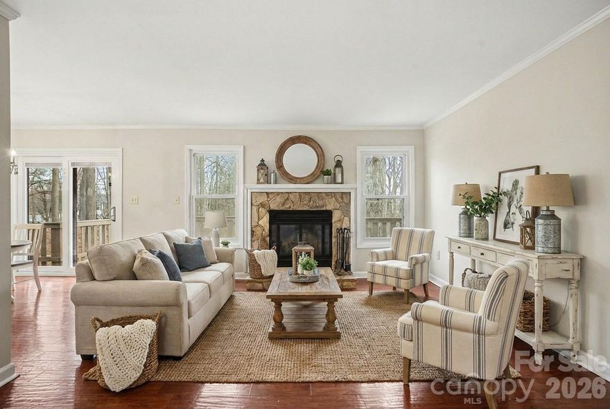 Welcome to the Dogwood Hills neighborhood, just minutes from downtown Fort Mill and surrounding popular Ballantyne, Pineville, and Charlotte. This end unit Condo is situated in a quiet wooded area and features a 2022 year roof, an encapsulated crawlspace, large deck, an outside storage area, and two parking spaces. This low maintenance condo offers easy living with the HOA handling the exterior maintenance, roof, lawn care, termite protection and garbage service. You The home is move in ready with **Professionally Painted Walls, newly installed carpet, and professionally deep cleaned**. You will love the galley kitchen that houses the laundry, custom cabinetry, granite countertops, and stainless steel appliances. The dining area and living room blend creating a large open area with lots of desirable natural lighting. The large living room features a stone faced wood burning fireplace, a huge wall to hang a flat big screen TV, and stool seating around the kitchen countertop. This is a great layout for entertaining guests. Lastly, enjoy three spacious bedrooms with walk in closets- including the primary bedroom and bathroom. Schedule your tour today!