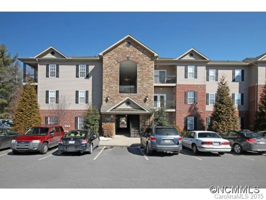 Immaculate and bright 2BR 2BA condo with mountain views has 9ft ceilings and crown molding, stainless appliances, large kitchen and clean baths. Lots of closets and W/D in unit. Quiet building with rear facing private patio overlooking wooded green space! Community has low fees that include water, trash, sewer and ample parking, picnic area grills and walking trails with doggie stations. Great location near Biltmore, just minutes to Downtown