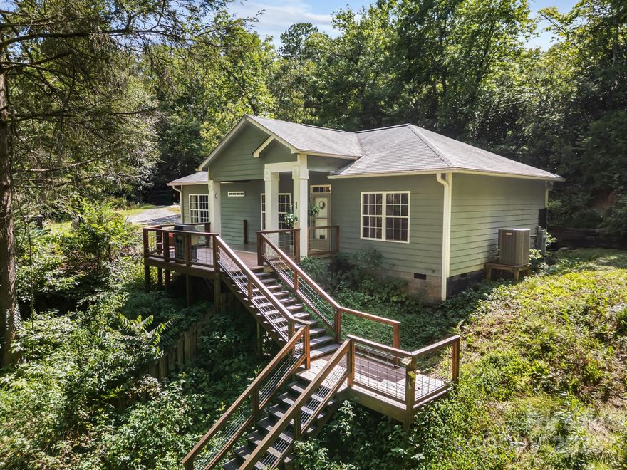 Tucked away on a private, wooded 1.6 acres with a babbling creek, this enchanting 3BR/2BA ranch home feels like something out of a storybook. Built in 2007, it blends nostalgic country charm with the low-maintenance benefits of a newer home—solid construction, a 2021 HVAC system, brand-new water heater, and other thoughtful updates throughout. Whether you're seeking an artist’s retreat, a romantic hideaway, or a successful short-term rental investment, this home delivers. But the location may be the standout element of this special property. The setting is peaceful and secluded, yet incredibly convenient: about 10 minutes from the Pisgah National Forest entrance and Turkey Pen trailhead, 15 minutes to downtown Brevard, and 20 minutes to the Asheville Airport. With absolutely no Helene damage, this property is priced aggressively to sell and won’t last long—don’t miss your chance to own a truly special mountain escape.