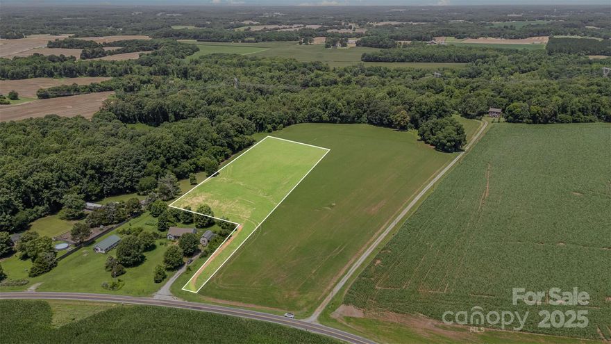 Discover five beautiful acres in a rapidly growing area of Rowan County—just minutes from scenic Sloan Park and with easy access to I-85 for a quick commute to Salisbury, Concord, Mooresville, or Charlotte. This level, open property is currently planted in soybeans and has already perked for a 4-bedroom home, offering endless potential for a private homesite, mini-farm, or investment opportunity. With no deed restrictions for building, manufactured and modular homes are welcome. High-speed internet through Spectrum is available—perfect for those who work from home. Enjoy peaceful rural surroundings with the convenience of nearby amenities and continued development all around. Gorgeous land in a prime location—don’t miss your chance to own a piece of it!