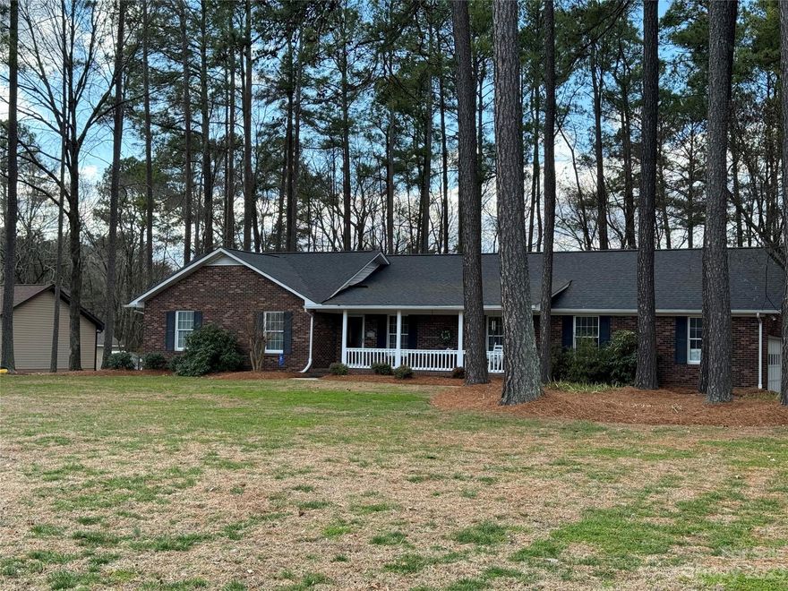 Are you looking for country living that is convenient to the city? No HOA? Would you like a 1-acre lot with a fenced backyard? Look no further! Nestled in Harrisburg's Huntwick neighborhood, this brick, ranch-style home has so much to offer. Dual primary suites and an upgraded kitchen with so many cabinets! Vaulted ceilings, an open floor plan, hardwood floors, gas log fireplace (that can be converted back to wood burning). Enjoy the wildlife from the back patio while having your morning coffee, or sit on the rocking chair on the front porch and say "Howdy" to the neighbors as they stroll past. The home is equipped with Anderson windows, a conditioned crawlspace, 16 seer Trane HVAC 2014, 50 yr architectural shingle roof 2024, new vapor barrier and insulation 2024, new dehumidifier in crawlspace in 2024, gas and electric dryer hookups, city water for the house, and a well for your exterior watering needs, and 10'x20' outbuilding. Did I mention the schools? Check them out!