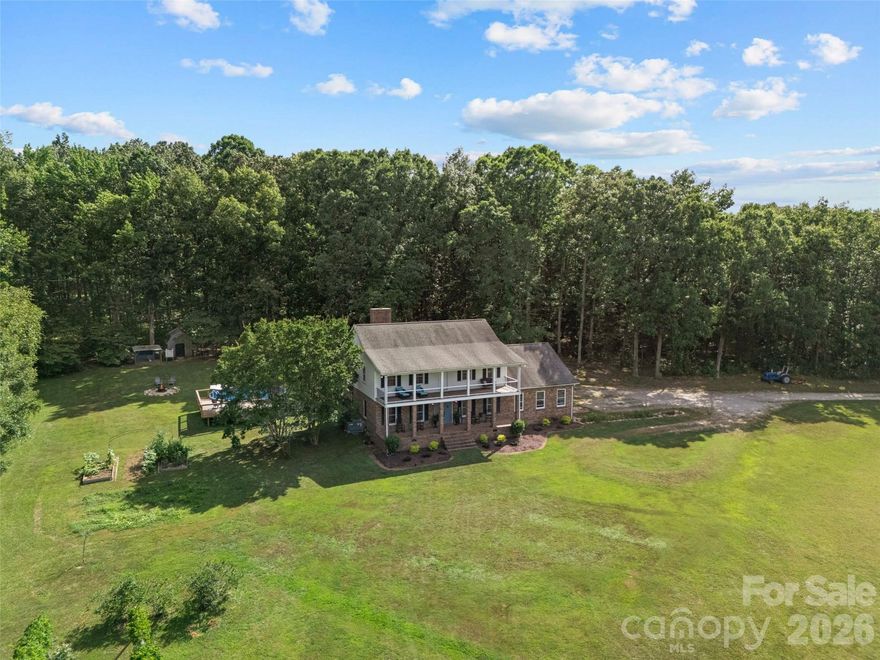 Nestled on 15.68 private acres, this custom-built 4-bedroom, 2.5-bath home offers the perfect blend of timeless craftsmanship and modern comfort. Step inside to 9-foot ceilings, beautiful hardwood floors, exposed wood beams, and a stunning wood-burning fireplace with custom built-ins that anchors the living space with warmth and character. The kitchen is both functional and elegant, featuring granite countertops, an eat-in breakfast area, and easy flow into the formal dining room, ideal for hosting gatherings large or small. A separate sitting room provides additional space for relaxing, entertaining, or working from home. On the main level, the enclosed garage has been transformed into a versatile bonus space, perfect for a home gym, playroom, media room, or easily convertible into an oversized primary suite thanks to the large storage closet already in place. All bathrooms have been tastefully updated with modern finishes, while the primary suite offers a spa-like retreat complete with a soaking tub, walk-in shower, and double vanity. Outside, enjoy the peace and privacy of your own land with a new above-ground pool and endless possibilities, whether you envision a farm, garden, animals, or simply wide-open space to roam and relax. This property offers the rare opportunity to own acreage without sacrificing comfort, style, or flexibility.
The possibilities here are truly endless.