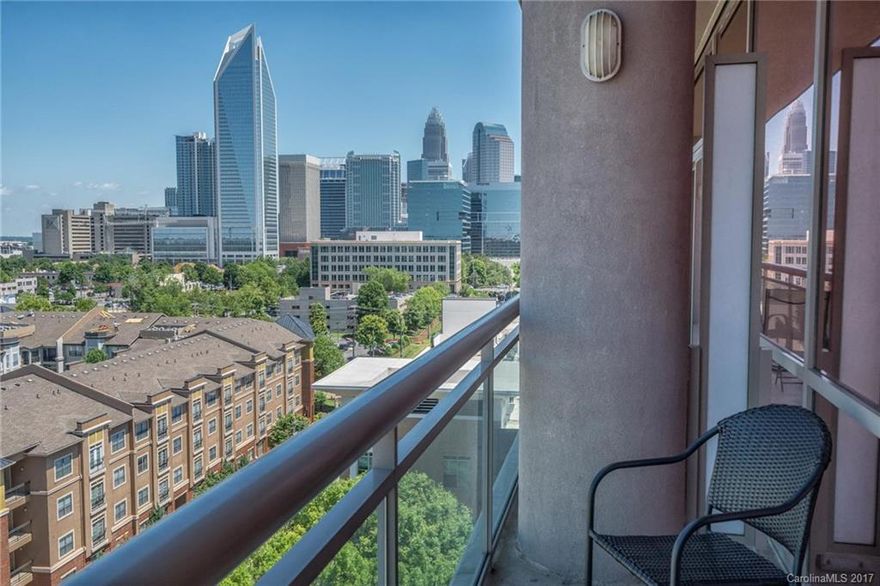 ONLY 2BR unit on the market at The Arlington with both UPTOWN and SouthEnd spectacular views! Corner unit with floor to ceiling glass, dual balconies and stunning sunset views.  Move in ready with brand new carpet, window shades, granite countertops, stainless appliances, decorator lighting, California like closet system in master closet, washer-dryer remain.  Don't miss the added extra storage in the 2nd full bath!  Watch South End or gaze at Uptown from your living room! Rooftop pool, fitness.