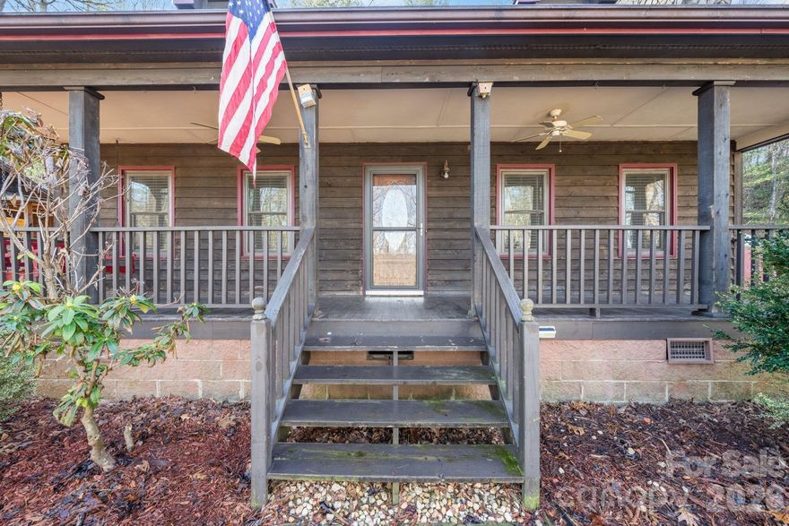 3BR/2BA home situated on approximately 4.95 acres offering a peaceful wooded setting and room to enjoy the outdoors. The home features about 1299 sq ft, wood flooring, and a functional layout with a laundry area. Upstairs you will find 2 more bedrooms and full bathroom. Enjoy the surrounding property from the covered porch/patio and deck. A red storage building with power and internet provides great space for a workshop, storage, or hobby area. Motivated seller – bring your offers. Convenient drive to Lenoir and nearby amenities.