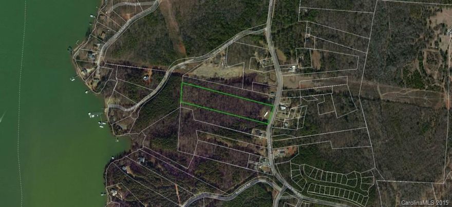 This 7.3 acres is wooded and is located near Lake Wyile and just one block up is the Yacht & Tennis Club.  City water is near the property and can be tapped into by paying the city tap fee. This property has huge potential and is perfect for that private estate setting.