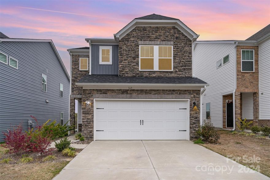 This gorgeous stone front home is completely move-in ready! Well-designed with a bright, open living area. Gourmet kitchen with beautiful white cabinetry & granite countertops, white tile backsplash, spacious island, gas cooktop, wall oven & microwave. Stainless steel appliances including a newer stainless steel refrigerator! Pantry & storage closet off of the kitchen. The upper floor includes the primary suite, 2 additional bedrooms, additional full bathroom, laundry room & loft. The Loft could make a great sitting area, play area or office space. The primary suite has a spacious bedroom, bathroom with beautiful quartz countertops, white cabinets & tiled shower. Large walk-in closet with window. Laundry room is easily accessible, with a newer washer & dryer! White faux wood blinds on the windows. Attached 2-Car Garage with MyQ app access. Camera doorbell & garage camera. Conveniently located to Kingsley Town Center, Anne Springs Greenway & highly-rated Fort Mill schools. A Must-See!!