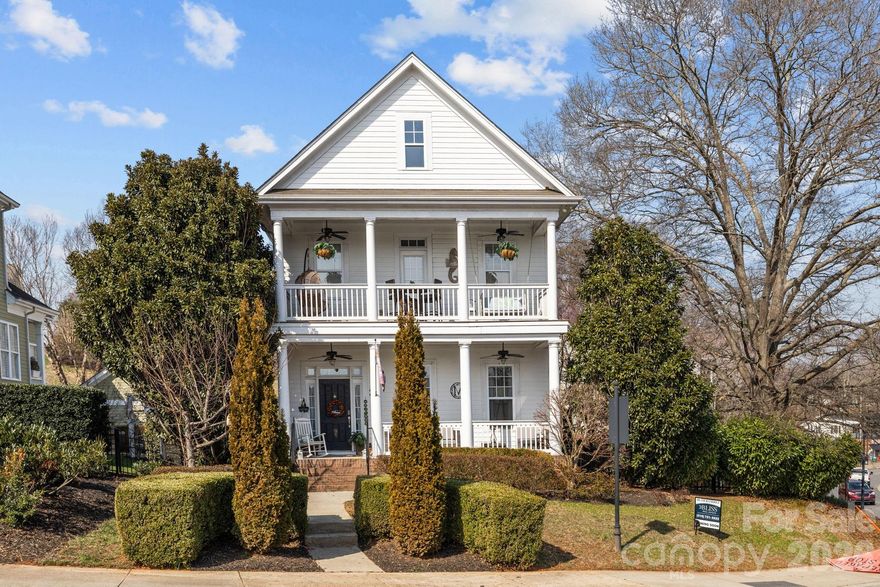 Storybook charm meets small-town magic in the heart of McAdenville’s Christmastown USA. Famously featured in Thomas Kinkade’s “Lights of Christmastown” painting, this true Southern gem offers 3 bedrooms and 2.5 baths with all bedrooms on second level. The inviting primary bedroom includes an en-suite bath, dual closets and private balcony- overlooking the pond- the perfect spot to enjoy morning coffee or a quiet, relaxing evening. Charming details shine throughout - from built-ins in the living room to the classic front porch. Enjoy outdoor living with a deck, a spacious backyard and side yard overlooking the fountains and lake, offering stunning views. The detached garage provides convenient parking while preserving the home’s charming streetscape. Walking distance to the shops and restaurants of Main Street. A rare opportunity to own a home where every season feels special. Famous for its holiday magic, McAdenville Village also offers timeless small-town charm that shines every day of the year.