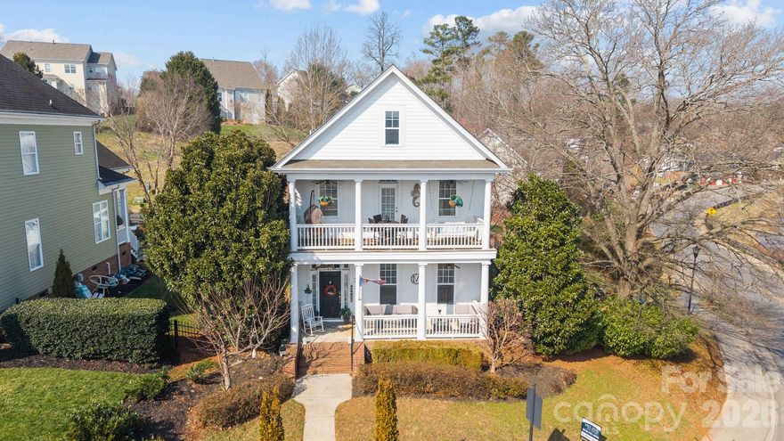 Storybook charm meets small-town magic in the heart of McAdenville’s Christmastown USA. Famously featured in Thomas Kinkade’s “Lights of Christmastown” painting, this true Southern gem offers 3 bedrooms and 2.5 baths with all bedrooms on second level. The inviting primary bedroom includes an en-suite bath, dual closets and private balcony- overlooking the pond- the perfect spot to enjoy morning coffee or a quiet, relaxing evening. Charming details shine throughout - from built-ins in the living room to the classic front porch. Enjoy outdoor living with a deck, a spacious backyard and side yard overlooking the fountain and lake, offering stunning views. The detached garage provides convenient parking while preserving the home’s charming streetscape. Walking distance to the shops and restaurants of Main Street. A rare opportunity to own a home where every season feels special. Famous for its holiday magic, McAdenville Village also offers timeless small-town charm that shines every day of the year.