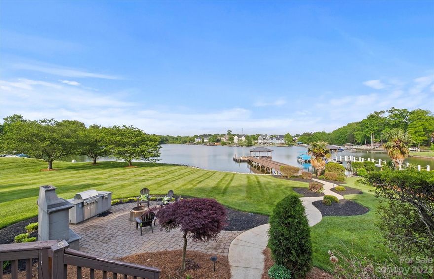 Welcome Home to 179 Castles Gate Drive. Experience pure tranquility & Lake Norman waterfront living yearround from one of the best lots in Morrison Cove! Rare opportunity to own this home sitting on over 1acre. The views are endless & are enjoyable both day and night! With 4BR/2.5BA and two OVERSIZED bonus rooms, Castles Gate is truly an entertainers paradise. Home features hardwoods throughout main floor and freshly shampooed upstairs carpet. Chefs kitchen with stainless steel appliances, granite countertops, and a large island makes this the perfect spot to host and entertain! Bonus room features surround sound and private balcony overlooking Lake Norman. Step outside and enjoy the LARGE deck and paver patio with outdoor kitchen, fireplace, fire pit & HOT TUB!! Other rooms include separate office, dining room, extra living area off of main two-story great room, laundry room and plenty of storage. Upstairs full bath has been modernly updated! ALL new interior paint. Circular driveway!