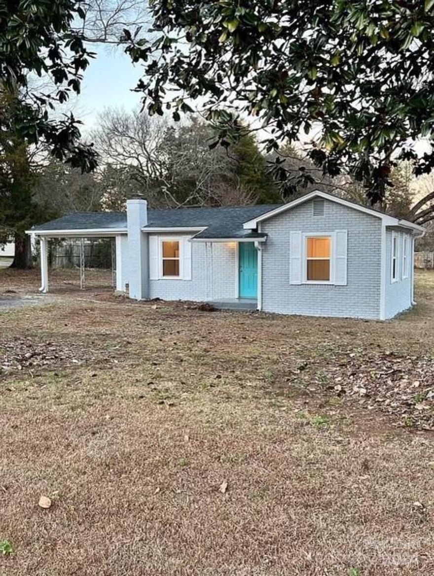 The cutest grey brick studio home you could find is ready for you to move right in! This open concept single family home is on nearly 1/2 acre lot with 2 beautiful huge magnolia trees. Home has an updated kitchen and bath, new flooring and comes ready with a washer, dryer and refrigerator! The location is super convenient to I-77, the hospital, and Winthrop, right off Celanese Road. This is the perfect rental or starter home or a great studio for a student. Rooms are not separate and layout is like a studio apartment. A great find for this price!