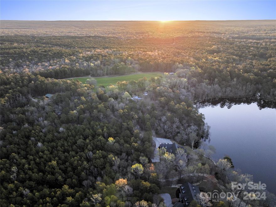 Goodwill Estate is a 736-acre, 7-parcel, gated haven. Surrounded by 3,600 acres of preservation land. While the estate has no conservation easements, its preserved land perimeter insures privacy and connection to the outdoors and wildlife. Steeped in history, Goodwill dates to 1795; added to the National Register of Historic Places in 1986. The property has two Charleston-inspired estate homes, examples of southern architectural elegance and modern luxury overlooking a pristine 35-acre lake. The 8,400-sf main home is offered furnished with custom furniture, valuable antiques, and artwork. The 5,488-sf 2nd home mirrors the main home luxury. Goodwill Estate is a blend of natural beauty with endless outdoor activities, rich wetlands, hardwood forests, 45 acres of fields and meadows, 12 miles of trails/roads and scenic Colonels Creek. Approval for a 22-lot community provides potential for expansion or conservation, presenting opportunities for both investors and homeowners alike.