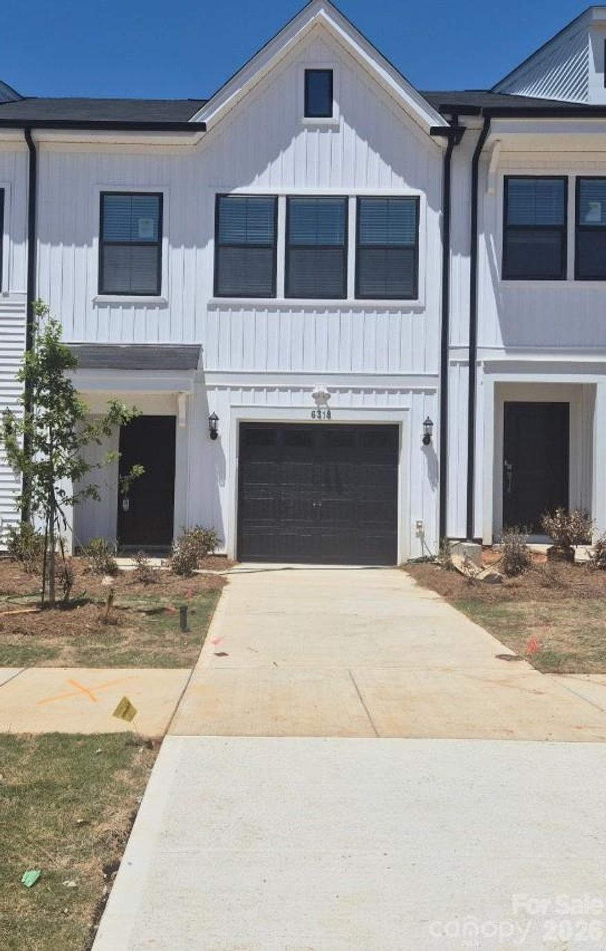 This two-story townhome includes three bedrooms and two-and-one-half bathrooms. Immediately inside the entrance, a hallway that leads past the staircase and half bathroom and into the open concept great room with an eat-in, kitchen, and patio. The primary suite features a walk-in closet, tray ceiling, and dual vanities. A laundry closet is located just outside of the primary suite for ultimate convenience. Two secondary bedrooms and one full bathroom are also located upstairs. A one-car garage and a bench and cubbies complete this floor plan.