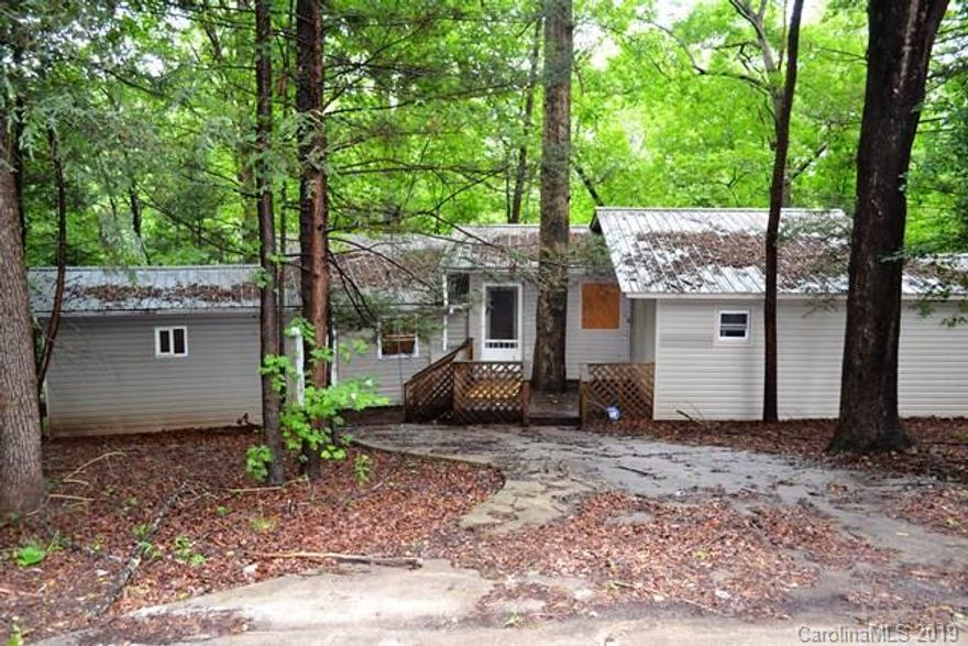 Investment opportunity.  A wonderful wooded setting with 0.87 acres, tucked away on a quiet street near Glen Alpine.  Owner makes no representations or warranties and is selling the property as/is, where is.  The owner has not lived in home and the home has  been unoccupied for many years.   Brentwood Water meter at street.