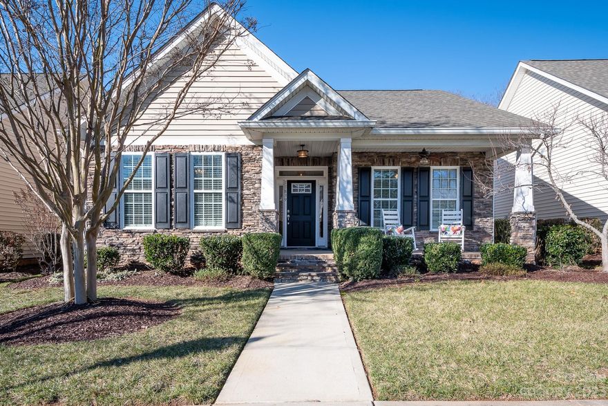 Enjoy this generously enhanced and spacious Hunter house plan in premier 55+ community.  Beautiful stone front home with rocking chair front porch enters into inviting, extended foyer and large, open great room, tray ceiling with wainscoting. The location is fabulous!!  Live like you are on vacation all year just steps away to Clubhouse, pool and activities or enjoy your very private treed yard off of enclosed sunroom or back screened porch.  Home has brand new Luxury Vinyl Plank flooring and interior has been recently refreshed and painted. Lighting is upgraded, granite countertops throughout, beautiful cream colored cabinets, stainless appliances and laundry room with handy laundry tub.  Washer, dryer and kitchen refrigerator are included in the sale however the Safe and Refrigerator in garage do not convey.  This is truly a Beauty!
HOA includes lawn maintenance, full time lifestyle director, clubhouse, resort style pool, Pickleball, tennis, wood shop, many clubs and so much more.