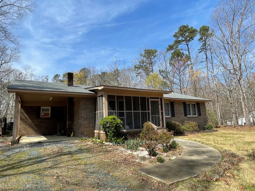 MONTGOMERY COUNTY - Country is calling!!  This 2-bedroom, brick ranch, features living room, dining area, bonus room, kitchen, screened porch, deck, attached carport, 2-storage buildings.  Located on country setting on 1.02 acre (as per deed).