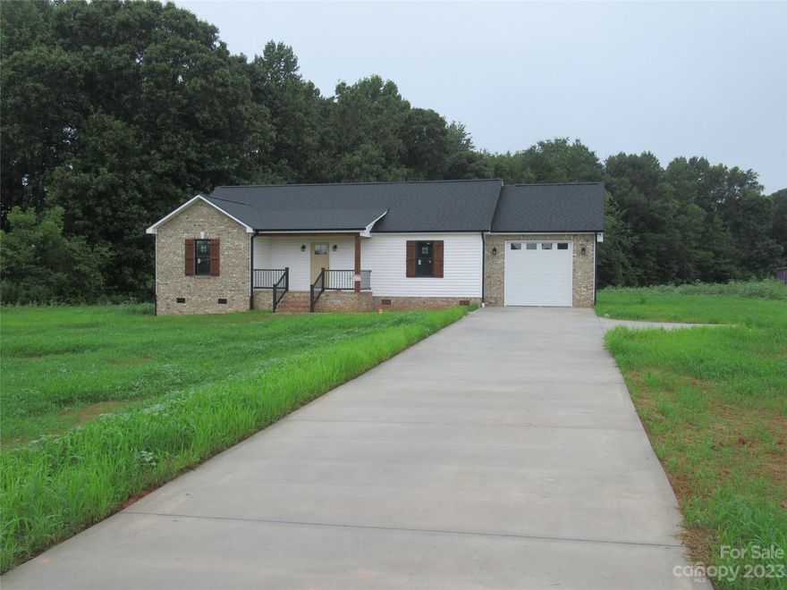 New Construction - 3 bedroom, 2 bath brick and vinyl ranch located in Western Lincoln County on a one acre lot.  This home offer wood floors, granite counters, custom cabinets, stainless appliances.  The split bedroom plan give the primary suite privacy.  Covered front porch, one car garage, and rear deck.  Located just off Hwy 27 for a convenient location & great schools.   Ready to move in August 2023