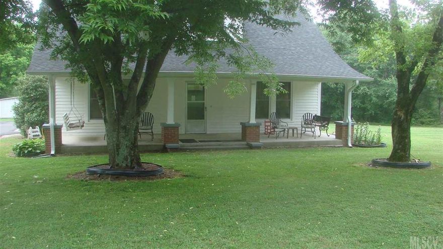 MOVE IN READY, 4 bedroom, Beautifuly renovated FARMHOUSE  with plenty of privacy on 8 + acres. Large rooms, with 9ft ceilings and fresh paint. Lots of storage space. Large covered front porch looks  out on mature pecan and black walnut trees. $40,000 + in updates and improvements....New master bath, New windows, public water and a well,new septic, HVAC in 2007, new roof in 2010.  3 car detached garage with lots of storage. Huge barn with many possibilities.  This listing includes pin 377010375347 that was initially listed separetly