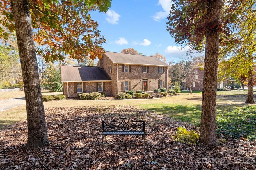 This home is far better than an average new build - with highlights including: quality construction, spacious rooms, mature landscaping, a large usable lot and most importantly - room to breathe! Be ready to fall in love with this FULL BRICK home in the highly sought-after Camelot community with NO HOA in the Hickory Ridge school district!  This beautiful home is situated on .67 acres in an established neighborhood central to all of the best Harrisburg has to offer!  The main floor features include a spacious formal living room and dining room, a dedicated office, half bathroom and eat-in kitchen with updated white Kraftmaid cabinets(2015), countertops and a brand new range. Relax next to the gas log fireplace in the large family room.  You'll appreciate the utility of the mud room with access to the garage, back deck, laundry and other half bathroom.  Upstairs you'll find an inviting primary suite along with 3 additional generously sized bedrooms and another oversized full bathroom.