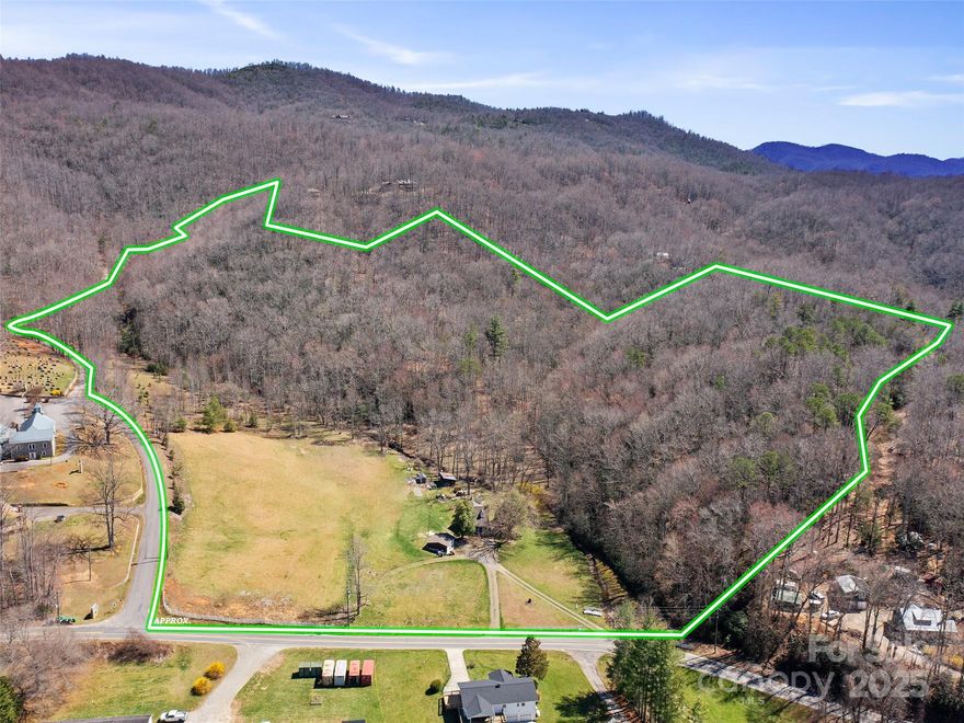 Beautiful 31 acre farm conveniently located about 30 minutes to Asheville, 25 minutes to Black Mountain.  Includes a 1920's brick, one BR farmhouse on about 10 acres of potential pasture and 21 acres of mature timber with multiple potential home sites having long range views of the Flat Creek and Garren Creek Valleys. Located adjacent to the picturesque stone Nesbitt Chapel, it is bordered  by paved publicly maintained roads (Nesbitt Chapel Road and Flat Creek Road) along the south and west sides allowing easy access for horse trailers and equipment.  Ideal for a horse farm with two small outbuildings and plenty of room to add a barn. A soil driveway leads to a potential home site with views from a ridge. Two streams cross the property w/potential to create a dug pond if desired. Zoning is Open Use, with present use tax assessment as forest land. This listing is 31 acres of beautiful, accessible land close to amenities. Seller is NC lic. Realtor. Tour and enjoy this lovely property.