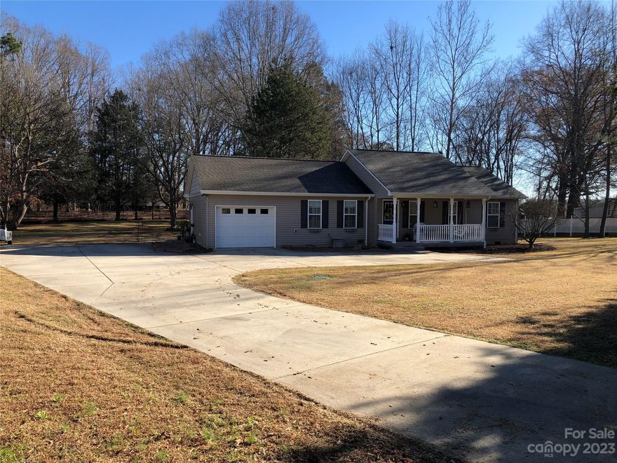 Don’t miss this well maintained gem, hidden away in Midland North Carolina. At the end of a dead end street but so close to all the conveniences you need. In the middle of Mint Hill and Locust. 485 is 10 minutes away. A beautiful ranch with split floor plan. Oversize one car garage with plenty of room for small workshop.Concrete driveway that is over 2800 ft.² to park all of your toys. 1310 HLA WITH OVER 1900 sq ft under roof. Note the detail and beauty that can be seen clearly throughout the house. 180 sq ft Large enclosed porch which is opened up to by two French doors, making it part of the dining living area of the main part of the house. Back yard looks out over a large mowed field, beautiful and peaceful. Listen to the fountain bubbling in the back yard or recline on the front porch and watch the sunset. Energy efficient home, electric bills in the $85-$90 range and water $18-$20 a month. Smart thermostat and Wi-Fi enabled newer hot water heater. Make your appointment today!