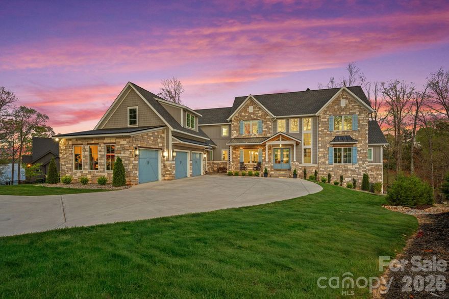 Luxury Waterfront Living on Lake Wylie

Experience the pinnacle of lakefront luxury with this newly built 2024 custom residence nestled along the shores of Lake Wylie. Privately set on 2.92 acres along a deep-water, dockable homesite, this 4-bedroom, 4.5-bathroom estate captures breathtaking panoramic views and unforgettable sunsets—offering a rare combination of space, seclusion, and refined waterfront living.

Inside, refined elegance meets elevated functionality with soaring ceilings, expansive windows, and rich pecan engineered hardwoods flowing throughout the main living spaces. The open-concept layout is anchored by a stunning chef’s kitchen featuring a suite of premier appliances, including a **Wolf range and microwave, Sub-Zero refrigerator, freezer, and wine storage, along with a KitchenAid dishwasher and ice maker. A well-appointed scullery adds both function and elegance—perfect for prep, storage, and seamless entertaining.

Statement living spaces are enhanced by artisan details, including dramatic Isokern fireplaces and custom Cooperstone Natural Stone finishes, with a striking Wichita White interior feature wall and a curated exterior blend of charcoal, Castle Grey, and Austin White—creating timeless architectural appeal.

The primary suite offers a private retreat with serene water views and a spa-inspired bath, highlighted by a designer Miseno tub filler. Thoughtful upgrades such as Visual Comfort ceiling fans and a fully integrated Sonos sound system—both indoors and out—create a seamless blend of comfort, ambiance, and modern convenience.

Seamless indoor-outdoor living continues with a covered patio, low-maintenance composite decking, and a fully equipped outdoor kitchen featuring premium **Coyote Outdoor Living appliances—perfect for lakeside entertaining year-round. A full, unfinished walk-out basement offers endless potential for customization—whether envisioning a home theater, fitness studio, or additional living quarters.

With nearly three acres of privacy, direct access to deep water, and the ability to build your own private dock, this exceptional property invites boating, paddleboarding, and the ultimate Lake Wylie lifestyle—all just a short drive from the conveniences of the surrounding area.