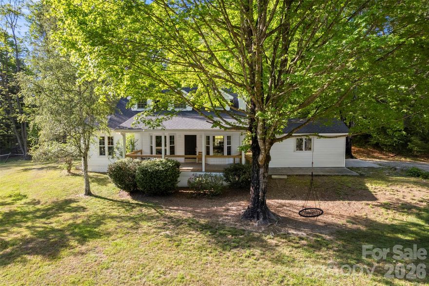 Welcome to your dream homestead where charm, comfort and possibility meet on nearly eight acres of rolling, fenced pasture. This picturesque property is suited for a mini farm, horses or anyone craving space to live a more peaceful, self-sufficient lifestyle. The quintessential white farmhouse greets you with a classic covered rocking chair front porch, ideal for slow mornings and relaxing evenings. Inside, you'll find a thoughtfully updated kitchen and baths that blend modern convenience with timeless character. A cozy screened porch offers a spot to unwind, entertain or simply take in the surrounding beauty year-round. The expansive barn provides endless opportunities, whether for livestock, storage, workshop space or creative ventures. The land itself is functional and inspiring, with gently rolling pastures ready for your vision. Tucked away for privacy yet just minutes from Hendersonville, Flat Rock and Brevard, this property offers the rare balance of seclusion and convenience. Whether you're dreaming of homesteading, equestrian living or a peaceful retreat, this one has it all!