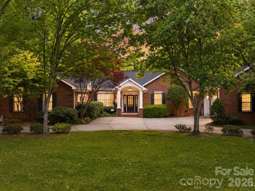 Welcome to one of North Carolina’s best-kept secrets—Statesville Country Club, perfectly positioned near I-77 and I-40 taking you anywhere you need to go! This established community is known for its stately homes, pristine golf course, and exceptional amenities, offering a lifestyle that makes it hard to ever want to leave.

This 4-bedroom, 6-bath brick ranch with a full basement delivers the ideal blend of main-level living and expansive space to grow, entertain, and unwind. From the moment you arrive, the circular drive and inviting curb appeal set the tone. Step inside to find a home freshly painted from top to bottom, featuring beautiful hardwood floors and an abundance of natural light throughout.

The main level offers a thoughtful layout with a traditional living room anchored by a fireplace, a spacious kitchen, formal dining areas, and a large family room tucked away from the bedrooms—perfect for hosting without sacrificing privacy. On the opposite side, you’ll find a secondary bedroom and full bath, along with a generous primary suite that opens directly onto a full-length back deck overlooking a serene, park-like backyard.

The fully finished basement is an entertainer’s dream, complete with additional bedrooms, multiple living spaces, and a wet bar—ideal for gatherings, guests, or multi-generational living.

Optional membership opportunities at Statesville Country Club provide access to a range of amenities, or simply enjoy the beauty and prestige of the neighborhood without joining. This is more than a home—it’s a lifestyle.living in a stunning neighborhood!