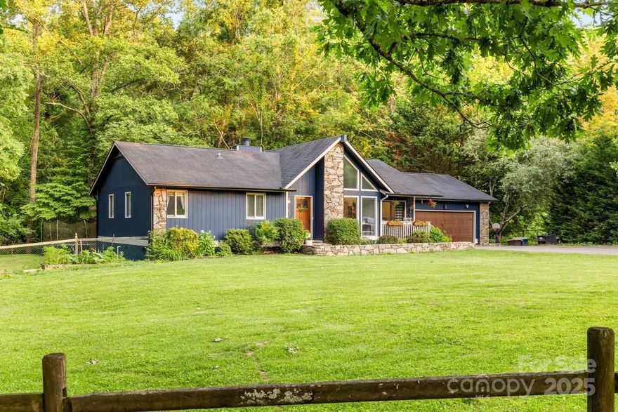 Tucked away at the end of a quiet cul-de-sac, this charming and move-in ready 3-bedroom, 2-bathroom single-level home offers spacious living on a beautifully flat, fenced lot just under an acre. Inside, enjoy a bright and open layout featuring a vaulted-ceiling living room with decorative beams, a cozy stone gas fireplace, and rich hardwood floors throughout.

The home boasts a refreshed kitchen with new appliances, granite countertops, and plenty of space for cooking and entertaining. The sun-filled flex room/sunroom provides extra space for a home office, playroom, or studio. The primary suite includes an updated en-suite bath with a walk-in tiled shower.

Step outside to enjoy the sprawling and quiet backyard with a fire pit, chicken coop/shed, and deck perfect for relaxing or entertaining. A two-car garage and extended driveway offer ample parking.

Close to hiking trails, shopping/dining, amazing schools and less than 20 minutes to downtown Asheville. Welcome home!