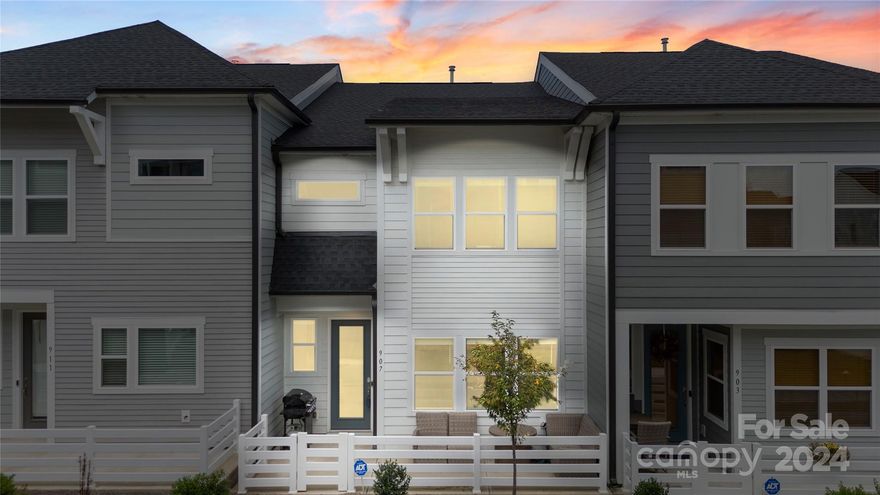 Welcome to this stunning 2-story townhouse featuring 3 bedrooms and 2.5 bathrooms. This fantastic open floor allows natural light to fill the living areas of the main level highlighting the laminate wood flooring and like new paint. The kitchen impresses with abundant cabinet space, gold fixtures and hardware, custom tile backsplash, an island with convenient eat-at breakfast bar and pantry! A spacious loft offers additional living space perfect for an office or flex space. The primary suite is a true retreat with a high-end custom closet, tiled shower and a dual sink vanity. The upgraded, advanced technology refrigerator is included making this home move-in ready. Enjoy mornings on the charming front porch and the convenience of modern living in this beautifully designed home. Great location with Uptown only a few minutes away and easy access to I77, 485 and CLT Airport!