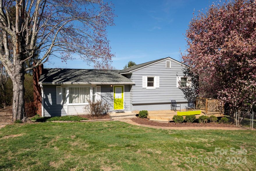 Experience the ultimate blend of convenience and tranquility in this move-in ready home. Nestled in a desirable location, this residence offers immediate access to both outdoor adventure and urban amenities.  Step inside to discover a functional floorplan spread across three levels. Upstairs, three bedrooms and a pristine bathroom await, providing ample space for rest and relaxation. On the main level, an open living area seamlessly connects with the dining and kitchen spaces including high end Bosch appliances, creating an inviting atmosphere for gatherings and everyday living. Additionally, in the lower level you find a private en suite room with its own outdoor entrance offering versatility with potential for a short term rental or a comfortable guest space.  Easy interior and exterior access to unfinished space in the basement complete with laundry and ample space for storage.  Large yard complete with sun deck and fenced in yard.