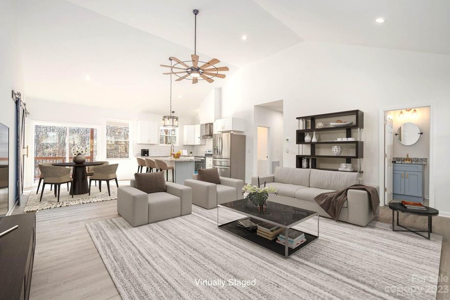 Picture perfect in every way! This one has it all…new construction ranch located on over 1 ACRE with NO HOA! Huge front porch welcomes you into the home w/ grand living space featuring a soaring cathedral ceiling surrounding the open plan! The kitchen features soft close cabinets, stainless appls, farmhouse sink, tile backsplash, large island & dining area. The primary suite is incredible - bedrm w/ tray ceiling, walk-in closet, luxury bath w/ large beautiful tile & glass shower plus separate tub, dual vanities & granite countertops. Split plan w/ 2 add'l bedrms & full bath opposite the primary. LVP in living areas & bedrms plus tile in all baths, no carpet, barn doors, granite in all baths, modern lighting, upgraded fixtures & so much more! Fantastic huge covered deck on the back of the home - great for entertaining inside & out, 597 sqft of outdoor living space!! Super private, lots of room for recreation on a cul-de-sac. Pay only COUNTY TAXES and located close to new 74 Bypass.