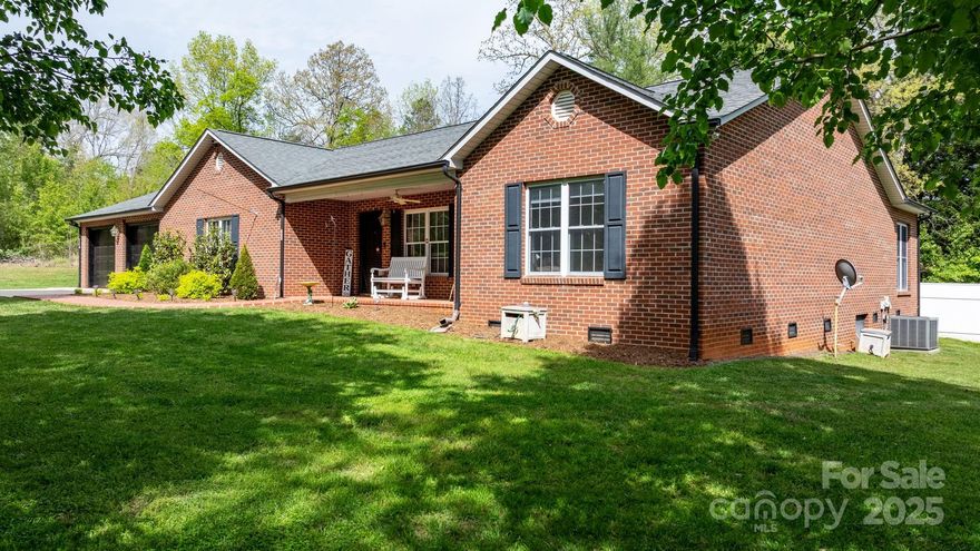 One level living in this All Brick Ranch!! 2302 heated sq ft. Conveniently located in Hudson but NO CITY TAXES!! Large .96 level lot with gorgeous fenced backyard and large patio! Living and Dining room with vaulted ceilings. ALL HARDWOOD AND TILED FLOORS... No Carpet!! Spacious galley style kitchen with Breakfast area and granite sink. Split BR plan. HUGE 20'2" x 15'2"primary bedroom with large walk-in closet, jetted tub, double vanities and separate shower. The spacious sunroom has beamed ceilings and will be your favorite relaxing spot! Porch and side walk with brick pavers. Laundry area and small office space. Oversized double car garage with storage cabinets. Wired Radio system throughout entire home.