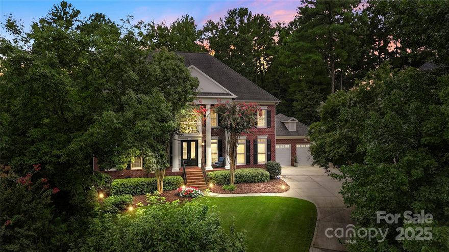 Prestigious Ballantyne Country Club home on a private cul-de-sac lot, offering 3 levels of luxurious living and designer finishes. The backyard oasis features a resort-style pool, hot tub with waterfall, outdoor kitchen, and tiered patio backing to trees and nature trails. Inside, the grand 2-story foyer welcomes you and flows into the elegant dining room, den and open living room with fireplace and wall of windows. The fully renovated chef’s kitchen boasts marble counters, glass-front cabinets, Thermador range, built-in refrigerator, and a massive island with seating. The primary suite offers a spa-like bath, custom closets, and a Juliet balcony overlooking the pool. Additional highlights include generously sized secondary bedrooms, tons of flex space, two laundry rooms, a bonus/media room on the third level, and a 3+ car garage. This home is a true show-stopper blending style, comfort, and entertainment amenities. Great location with tons of shopping and restaurants near by!